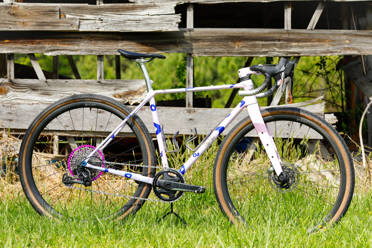 The 401 — full profile in a grassy field against an old barn wagon