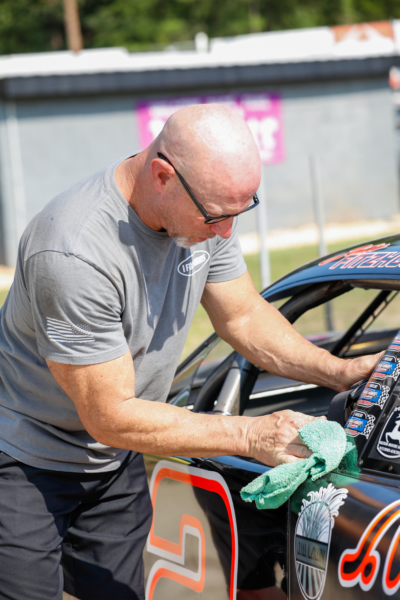 Wiping down the race car before the shoot