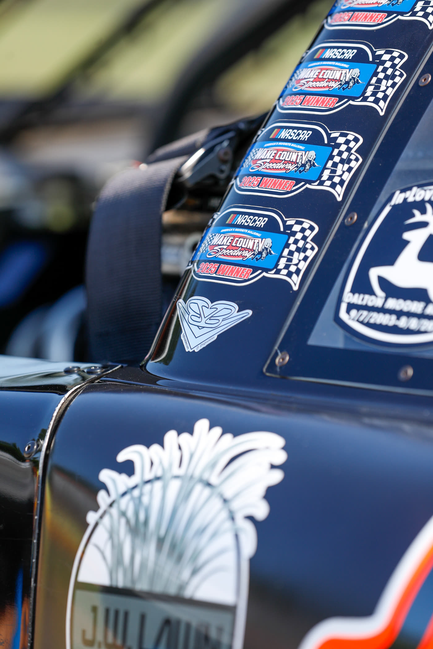 Sponsor decals down the roof rail of the late model