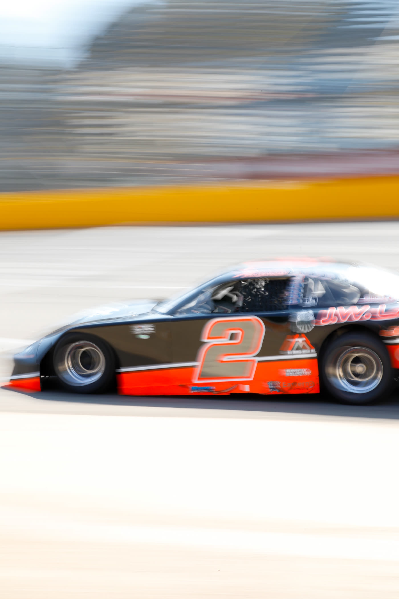The number 2 car at speed coming off the corner