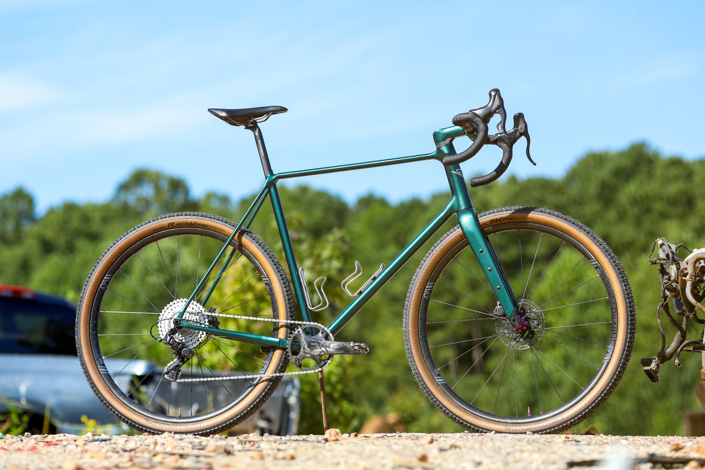 The 401 gravel frame — full profile against a clear blue sky