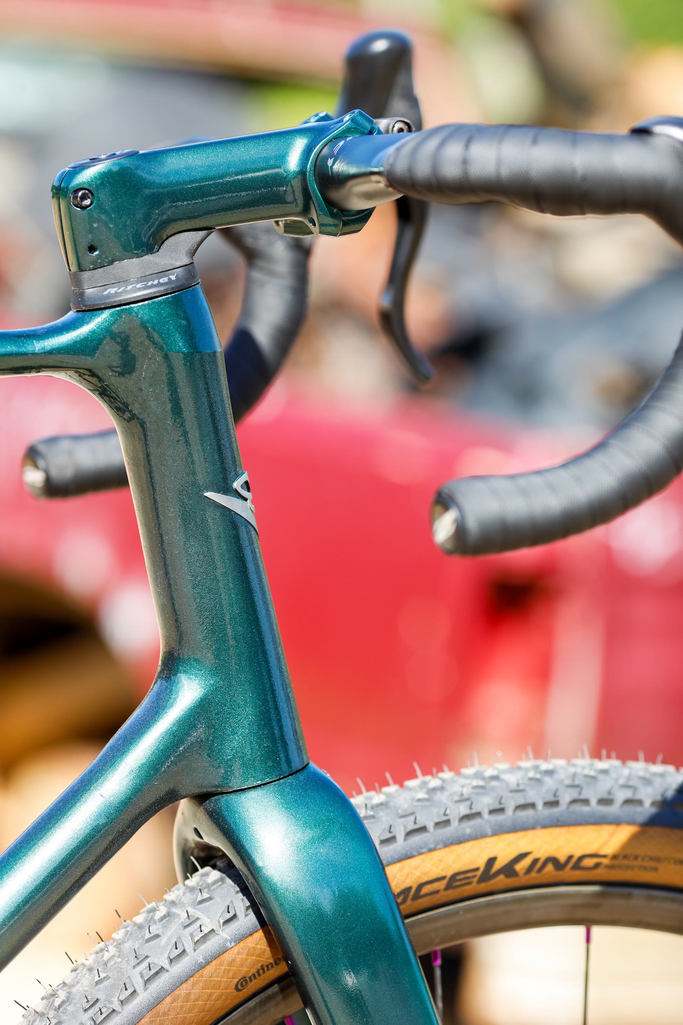 Head tube detail with red car blurred in the background