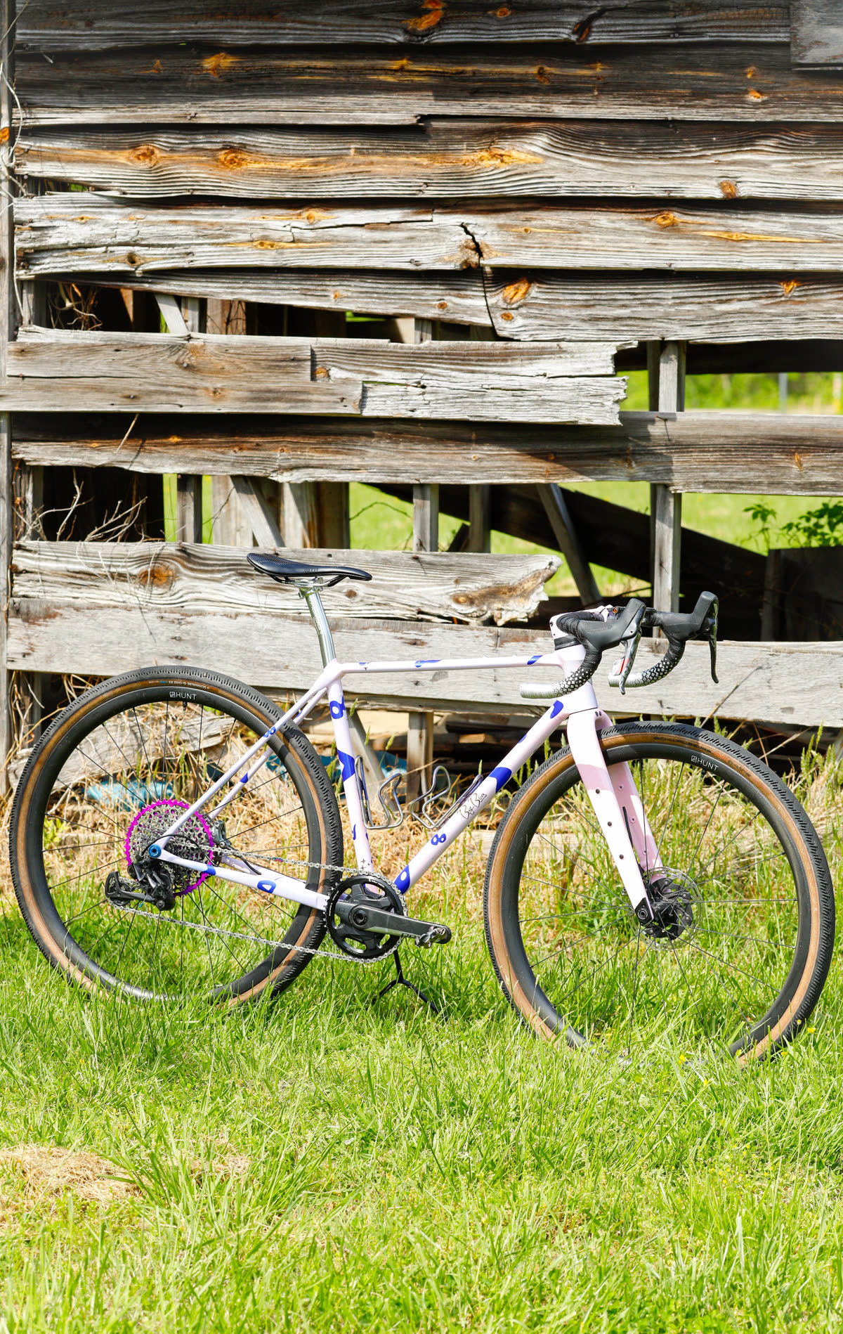 The 401 standing in tall grass in front of an old barn