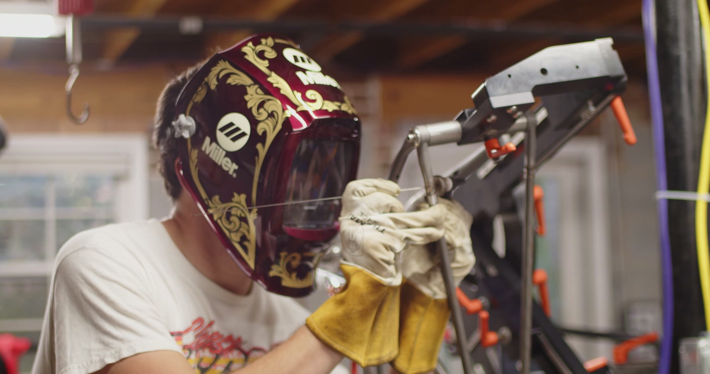 Close-up of the Miller welding helmet with ornate gold design